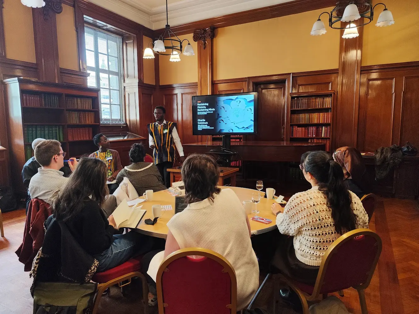 Charlie Cobbinah presenting at an academic event